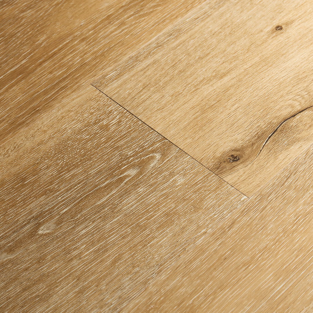Howell Mountain Artisan Hardwood Innova Howell Mountain waterproof SPC vinyl plank flooring in a light natural oak tone, close-up