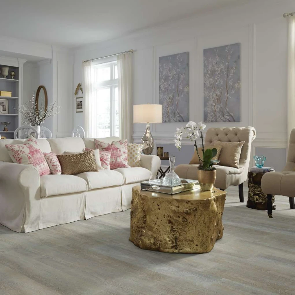 Living room with pale whitewashed wood-look waterproof flooring installed by Kwest Flooring Services